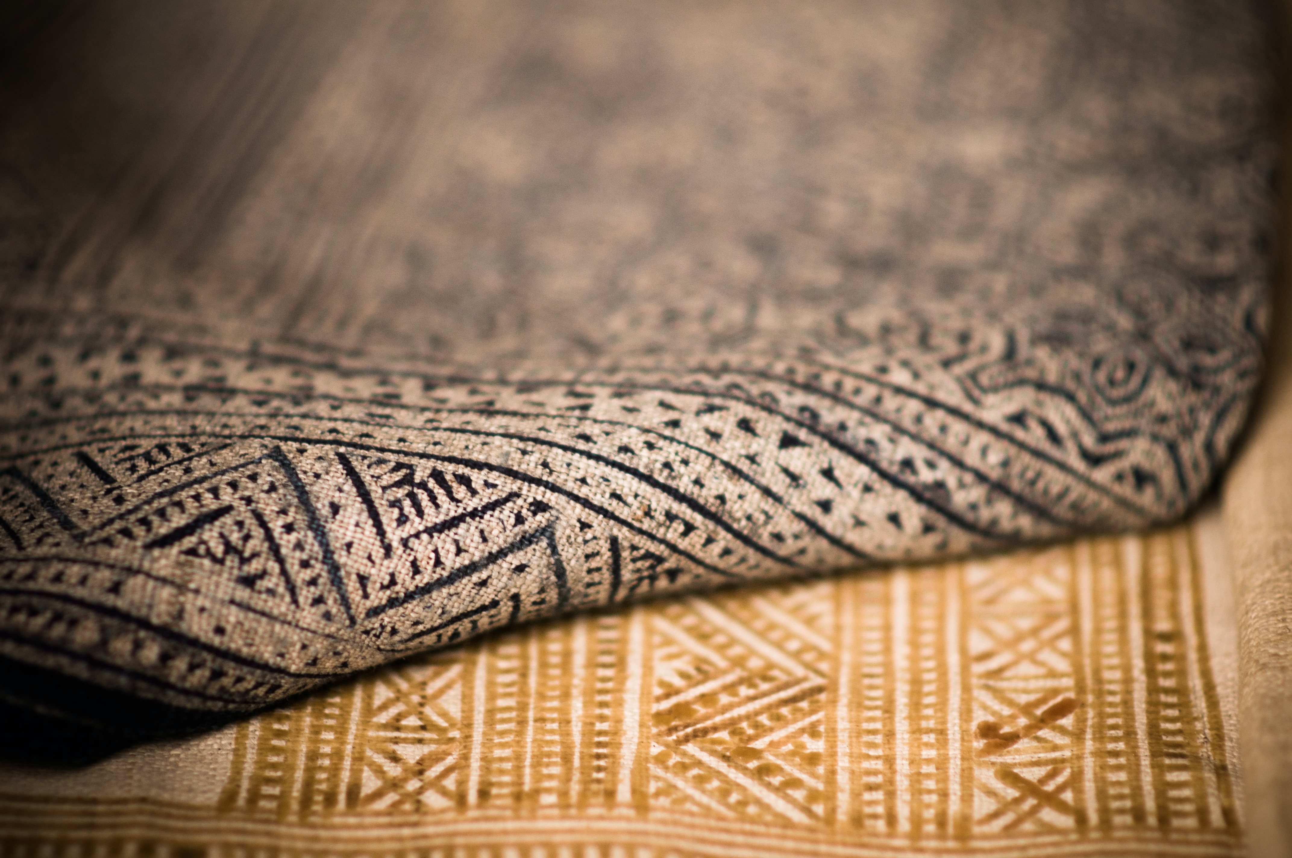 A black and a brown carpet